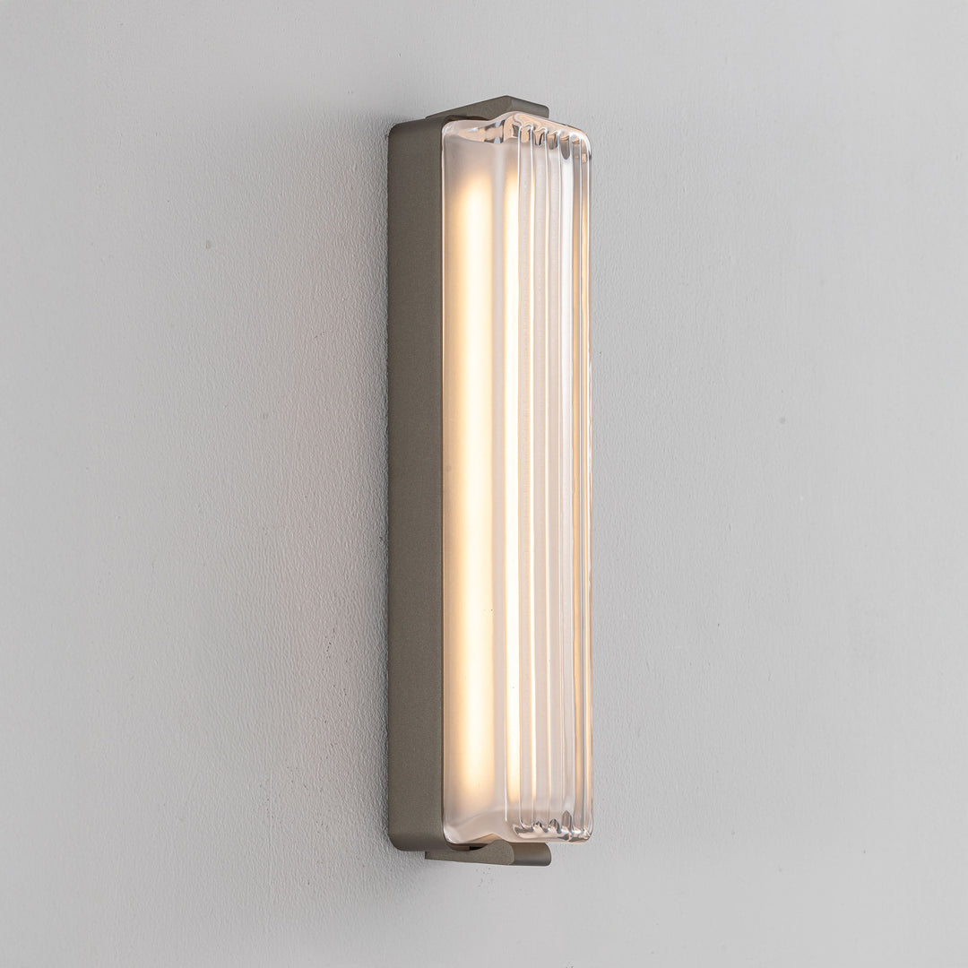 Striato wall light modern LED wall lamp with ribbed satin glass diffuser providing warm ambient lighting for contemporary interior spaces.