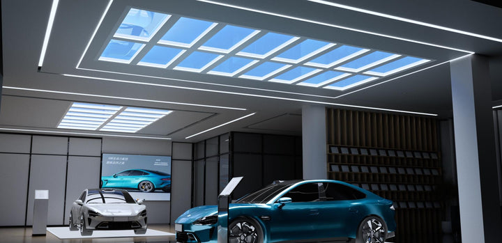 Lucretia Lighting U-Skylight LED sunlight simulation skylight providing natural daylight-style illumination in a modern car dealership showroom