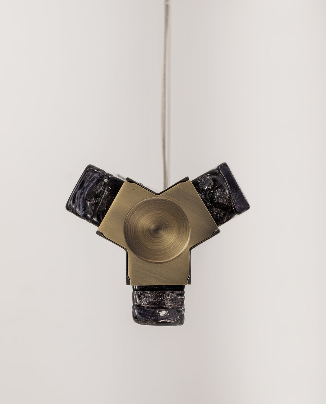 Precision-machined aluminium frame with smoked textured glass linear pendant.