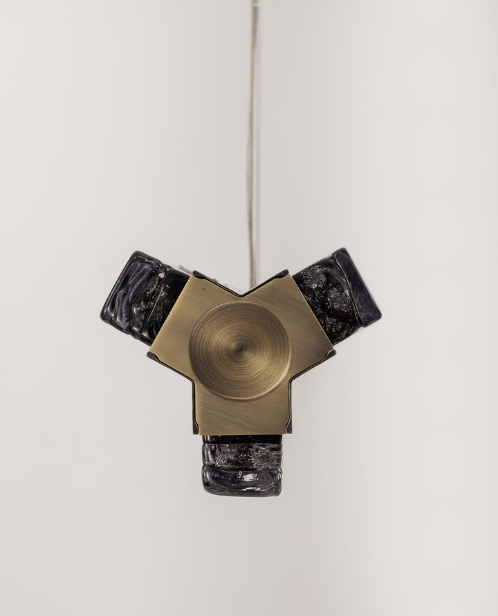 Precision-machined aluminium frame with smoked textured glass linear pendant.