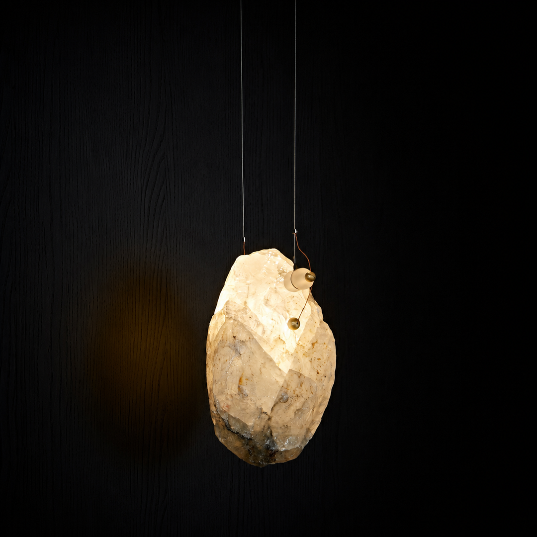 Raw Brazilian crystal pendant light handcrafted from naturally formed crystal with warm LED illumination.