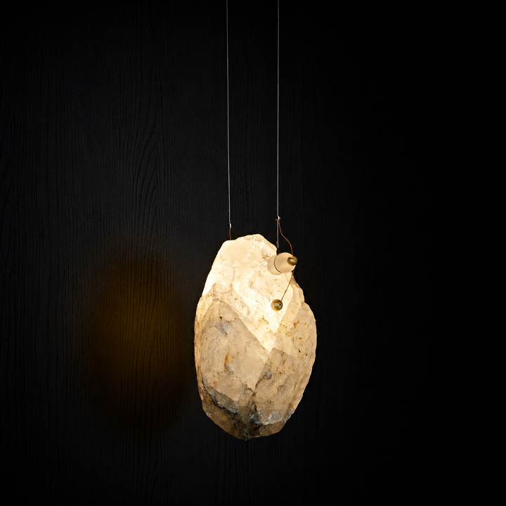 Raw Brazilian crystal pendant light handcrafted from naturally formed crystal with warm LED illumination.