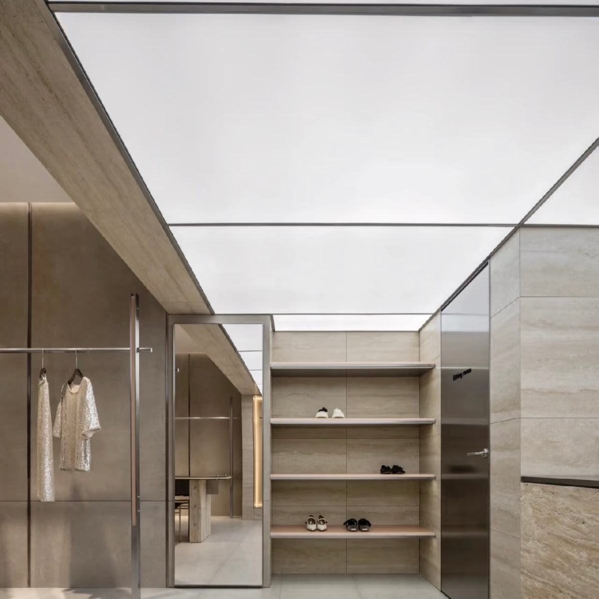 Lucretia retail LED stretch ceiling panel providing a seamless backlit ceiling for modern store interiors.