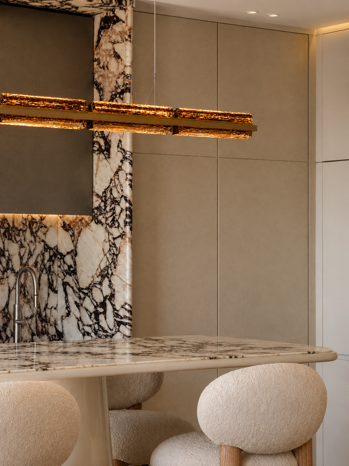 Modern designer linear pendant light for luxury kitchens and dining spaces.