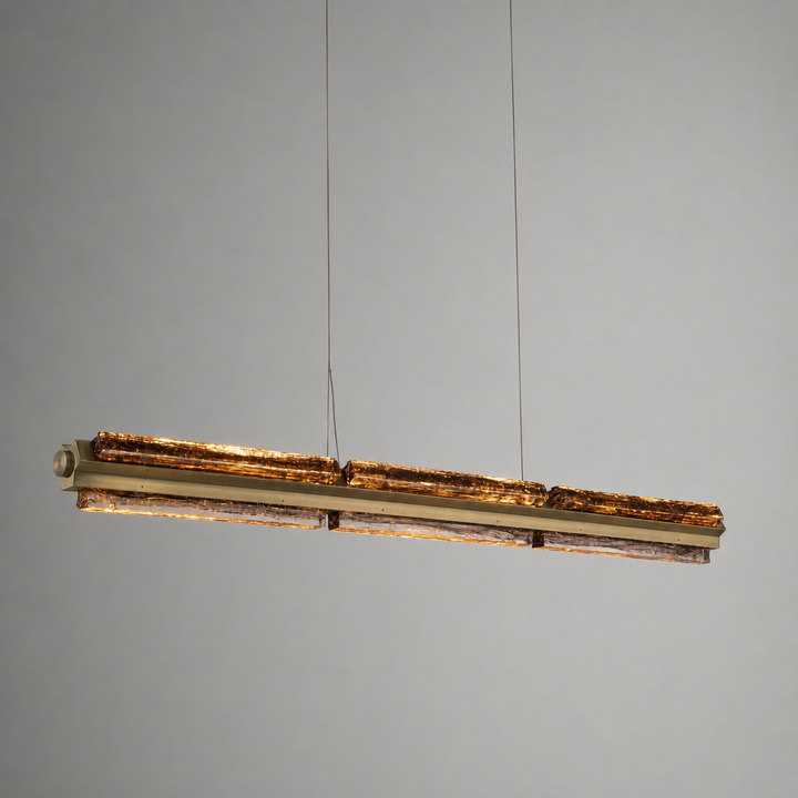 Angled view of the Running Water Horizon hand-blown glass linear pendant light.