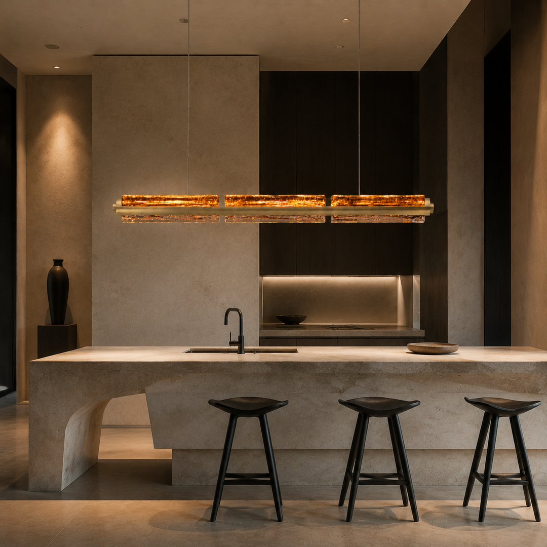 Running Water Horizon luxury linear pendant light installed above a modern dark kitchen island with hand-blown textured glass.