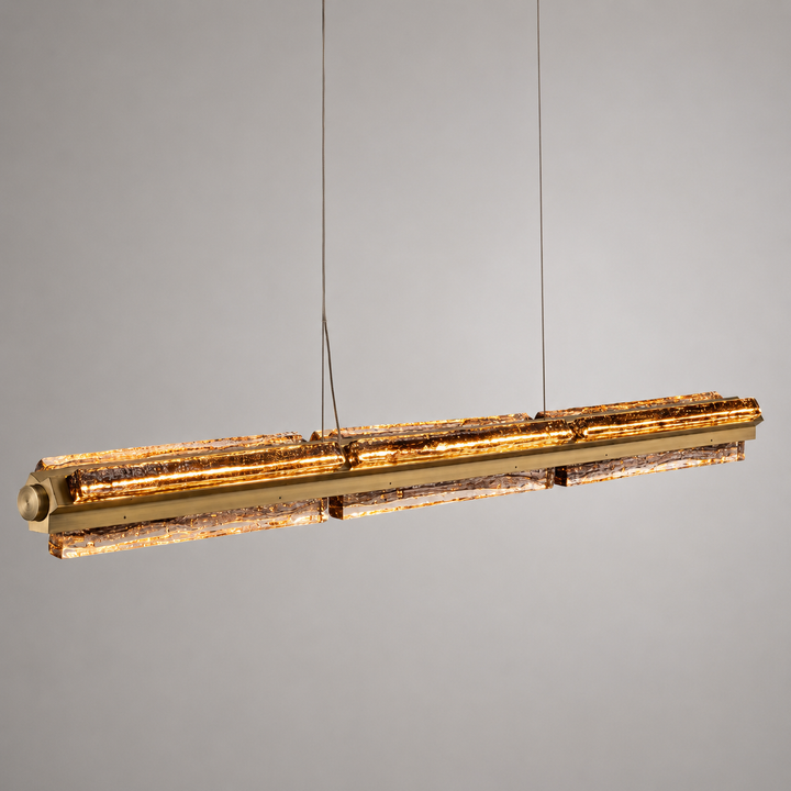 Luxury architectural linear pendant featuring handcrafted textured glass and integrated LED lighting.