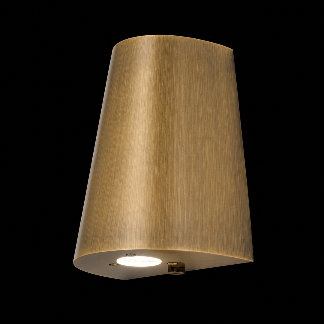 Handcrafted solid brass tapered outdoor wall light in antique brass finish with integrated LED for luxury outdoor architecture.