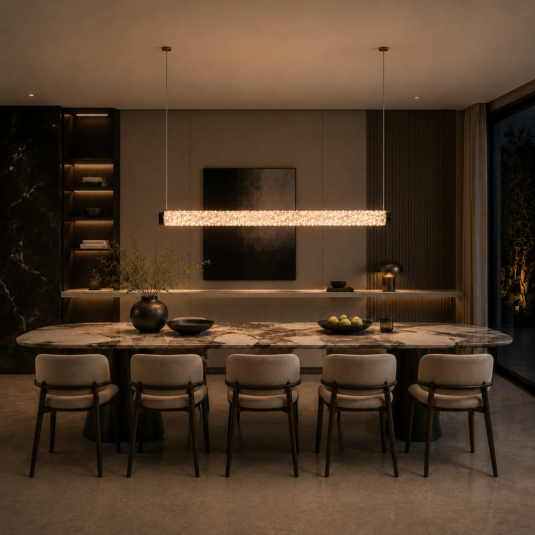Luxury crystal linear pendant light over a dining table, handcrafted crystal LED suspension lighting for modern homes, architectural interiors and bespoke lighting projects.