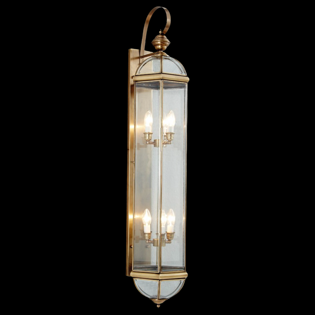 Marseille 1200 brass exterior wall lantern with tall open-frame design and clear glass panels for classic outdoor façades.