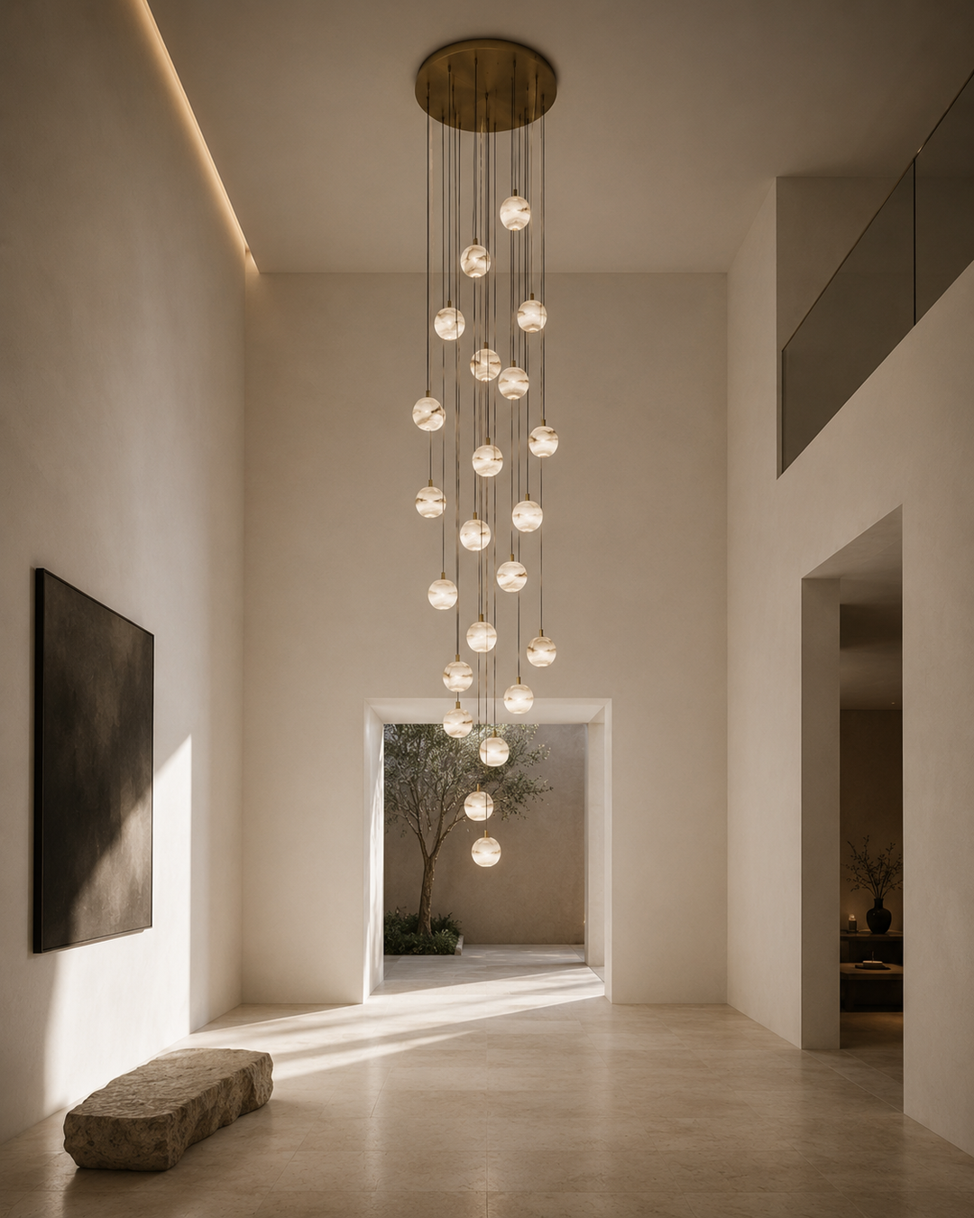 Modern alabaster pendant light installation suspended in a double-height gallery residence, featuring handcrafted natural stone lighting within a minimalist luxury architectural interior.