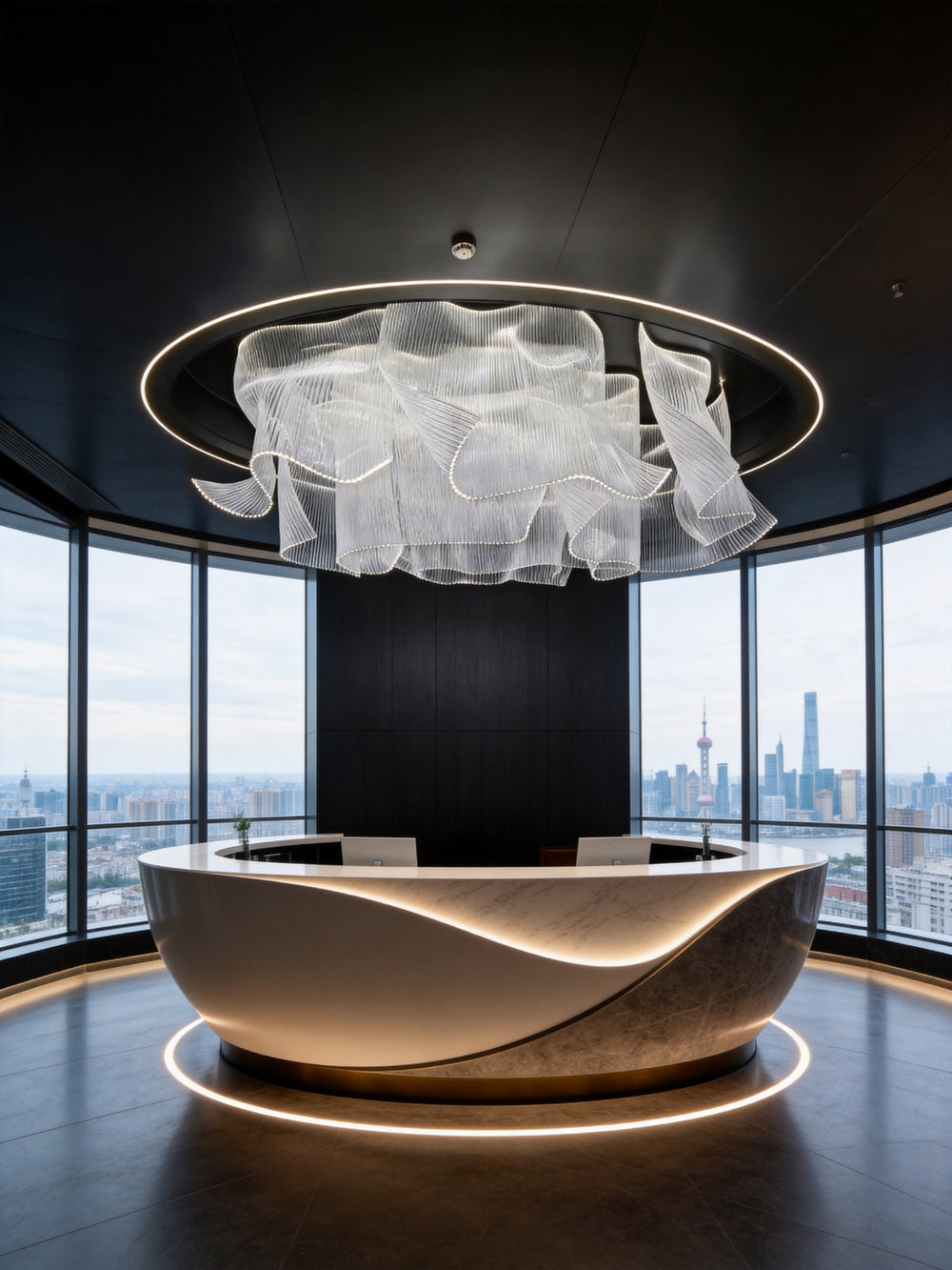 Modern bespoke chandelier suspended above a luxury hotel reception area with contemporary architectural lighting design.