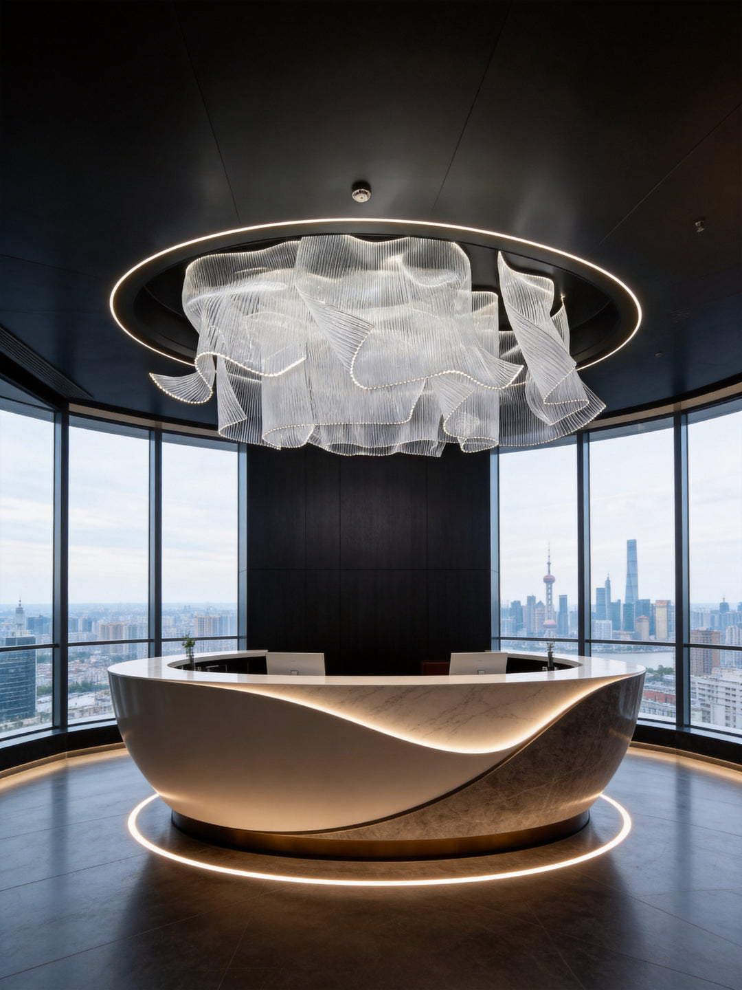 Modern bespoke chandelier suspended above a luxury hotel reception area with contemporary architectural lighting design.