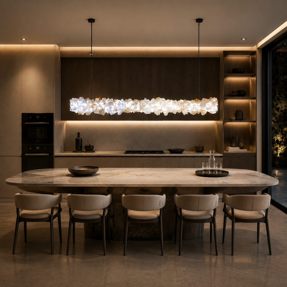 Modern crystal linear pendant light over a kitchen island and dining area, handcrafted Brazilian crystal LED chandelier for luxury residential interiors and contemporary architectural lighting.
