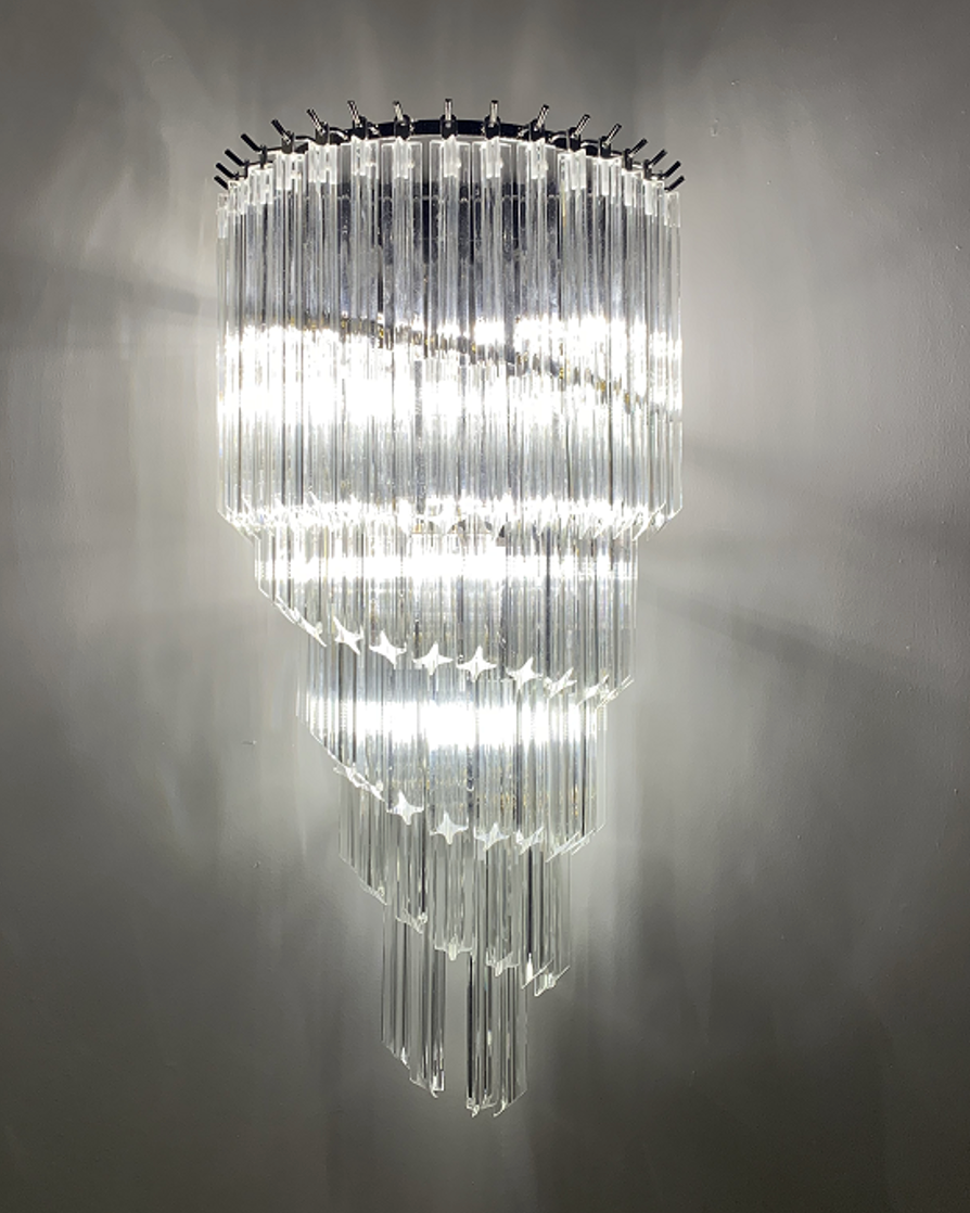 cascading crystal glass wall lamp creating a dramatic lighting effect in a modern interior space