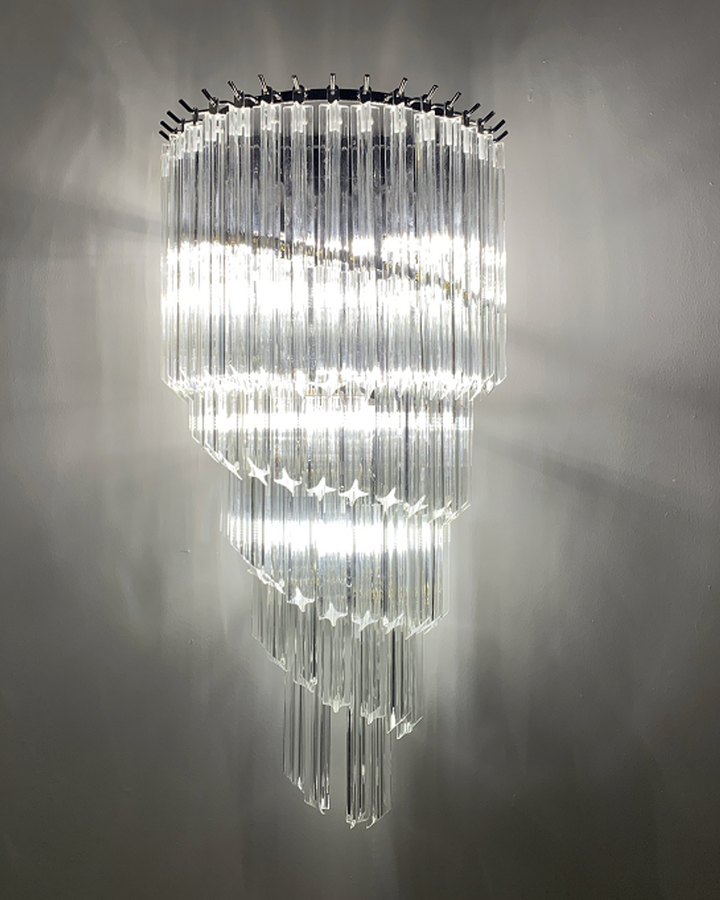 cascading crystal glass wall lamp creating a dramatic lighting effect in a modern interior space