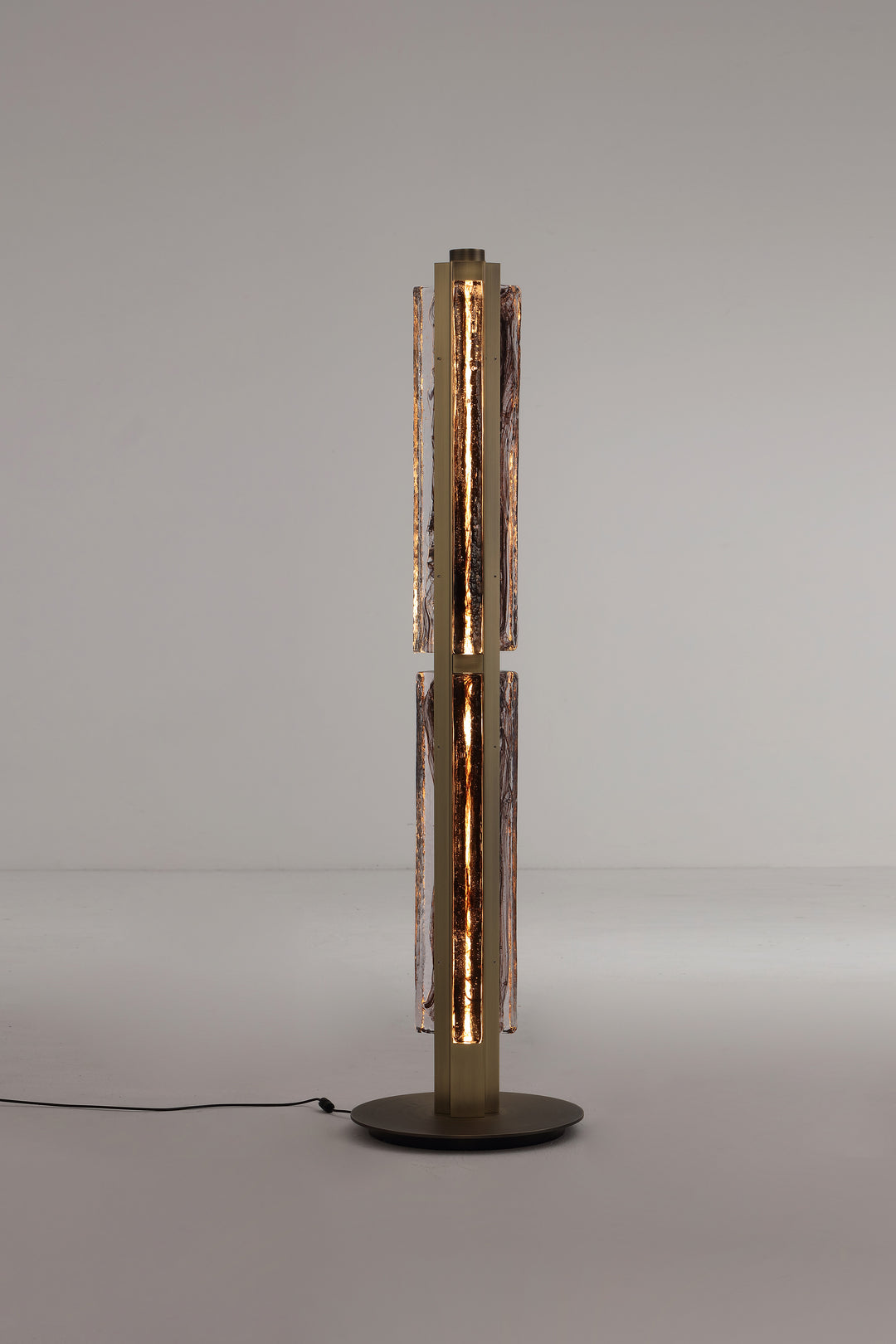 Modern floor lamp with hand-blown textured glass and brushed metal finish