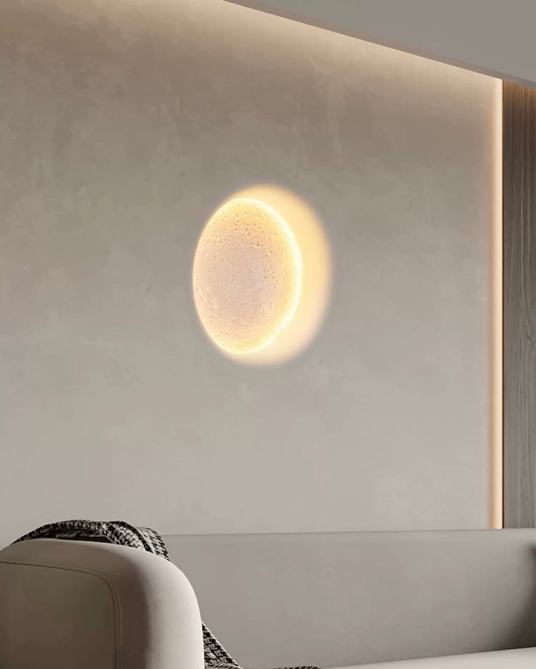 modern round gypsum LED wall light on a white wall providing soft indirect ambient indoor lighting