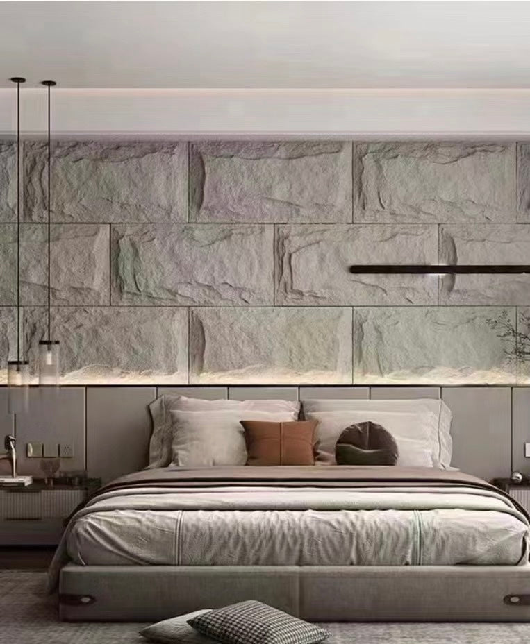 MushRock lightweight rock-look wall panels used as a stone-style bedroom feature wall.