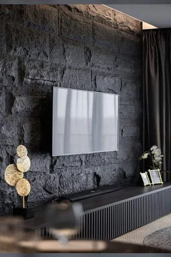 MushRock lightweight rock-look wall panels used as a textured TV feature wall with natural stone appearance.