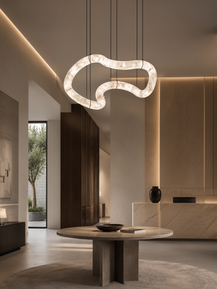 Nexus Spanish Alabaster Organic Pendant Light suspended above a luxury foyer, handcrafted from genuine Spanish alabaster.
