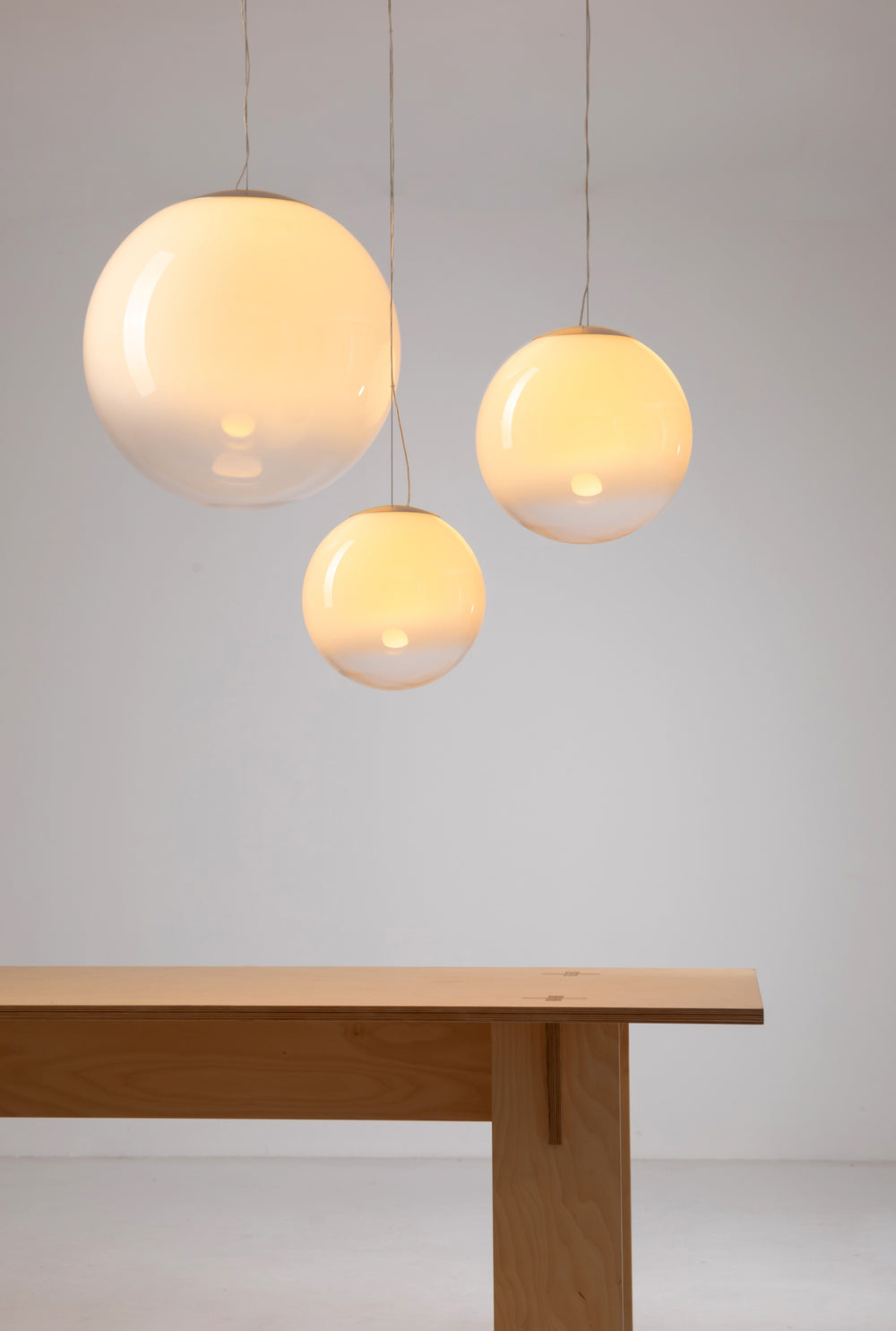 Norden Frost Sphere glass pendant light shown in three pendant sizes