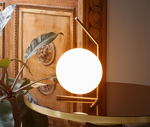 Opal globe table lamp styled in a warm timber interior, perfect for shelves, consoles and bedside ambient lighting in contemporary homes.