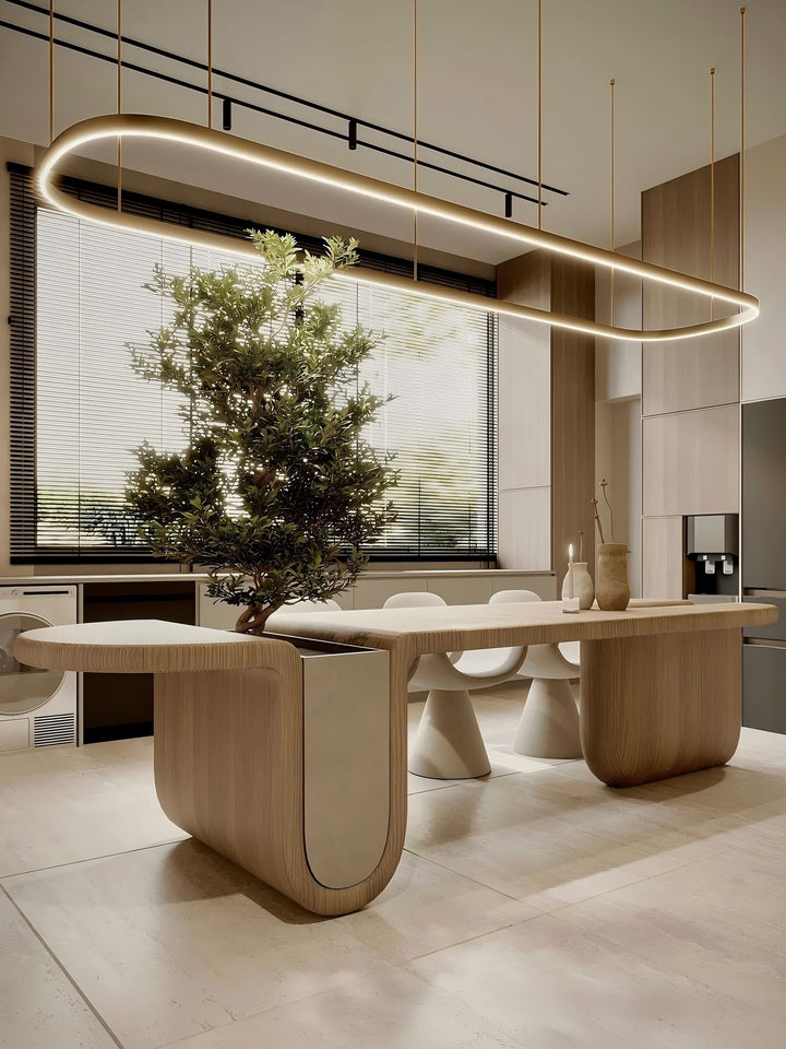 Custom oval LED ring pendant light in a luxury dining room with natural light through venetian blinds, side view showing timber table curved end detail, Oval LED Ring Bespoke Lighting by Lucretia