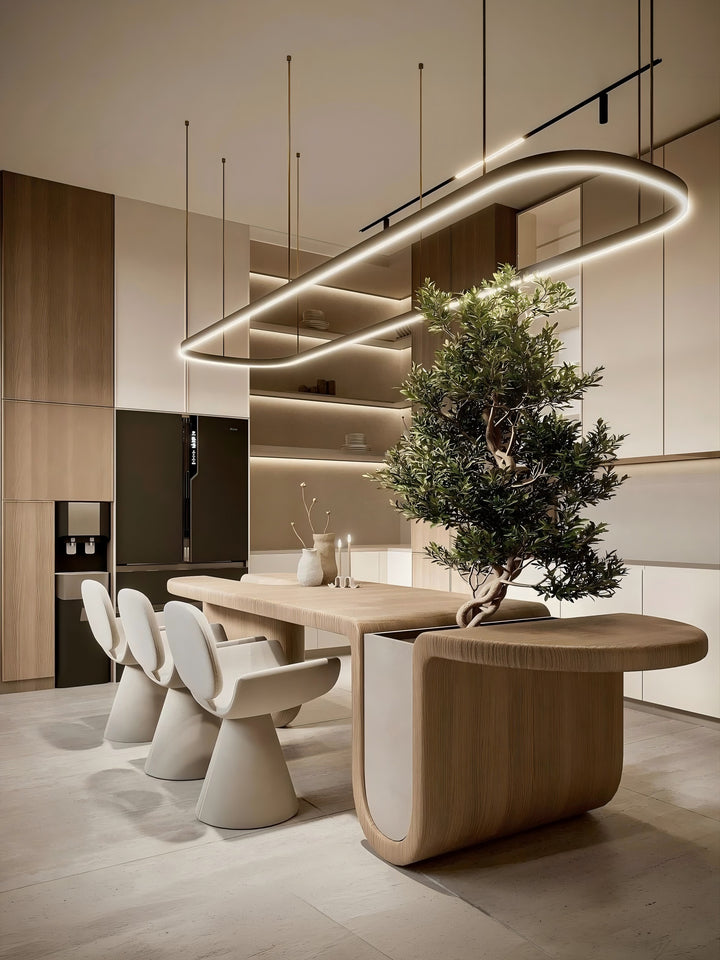 Custom oval LED ring pendant light in an open plan kitchen and dining room with warm timber cabinetry and indoor olive tree, Oval LED Ring Bespoke Lighting by Lucretia