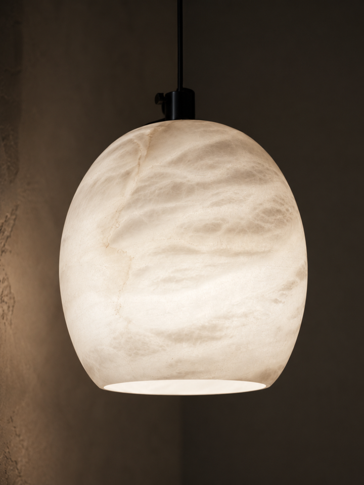 Ovela natural Spanish alabaster pendant light showing unique stone veining and warm translucent glow