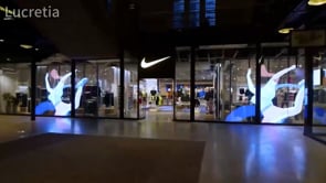 PureView Pro LED mesh display installed in Nike retail store window, showcasing transparent LED screen for premium storefront advertising