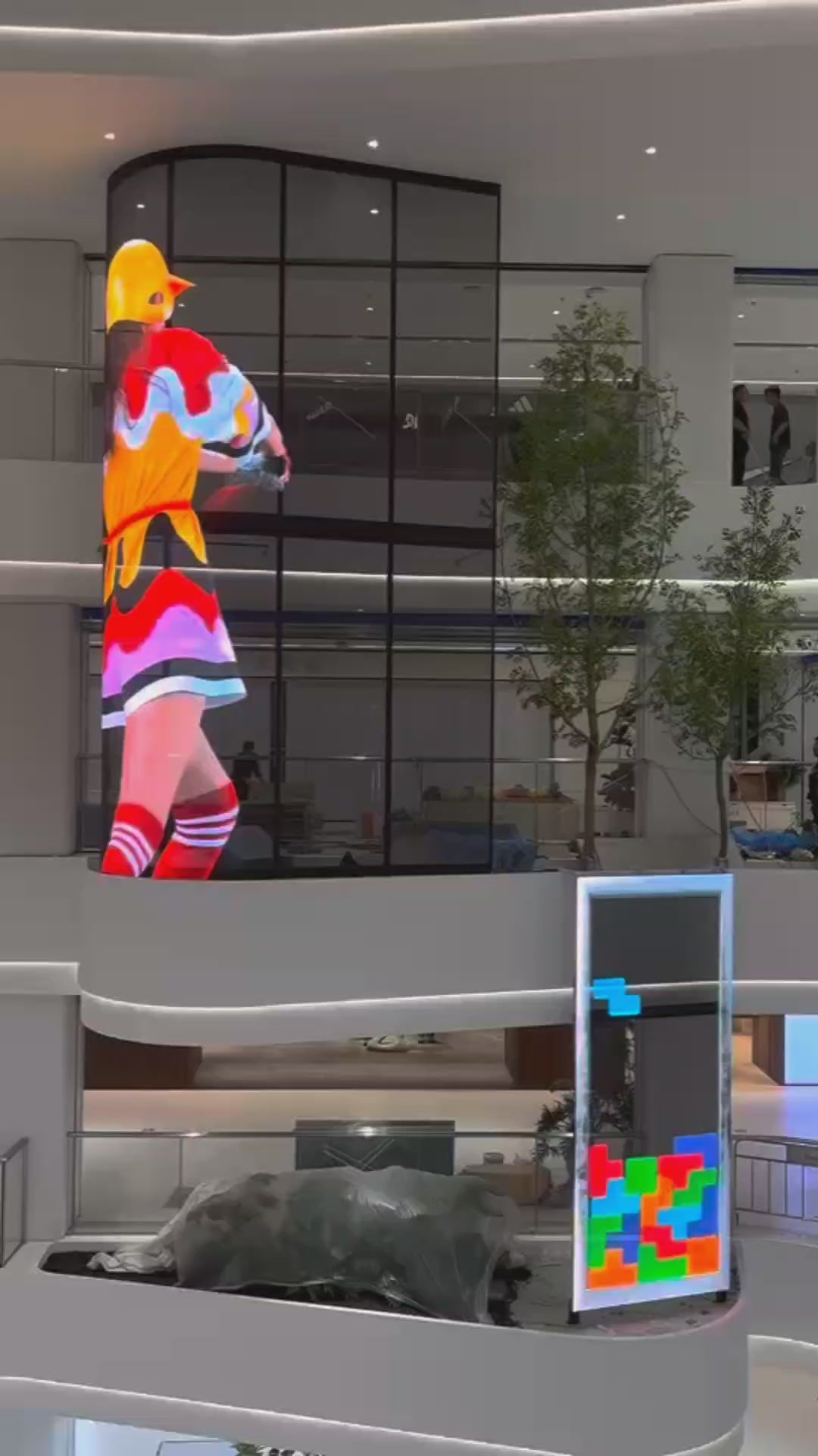 Transparent Holographic LED Display integrated into a freestanding digital totem for shopping centres, exhibitions and commercial environments.