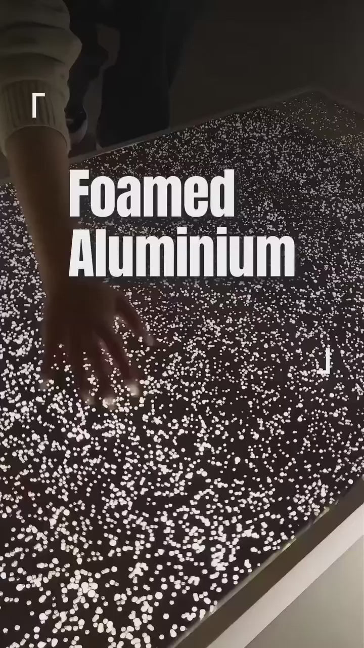 Translucent aluminium foam panel surface demonstrating light diffusion and textured foamed aluminium structure for architectural wall applications