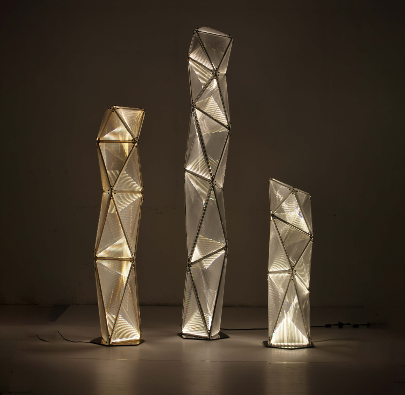 Proteus Floor Lamp with three geometric illuminated LED panels in sculptural tower design.
