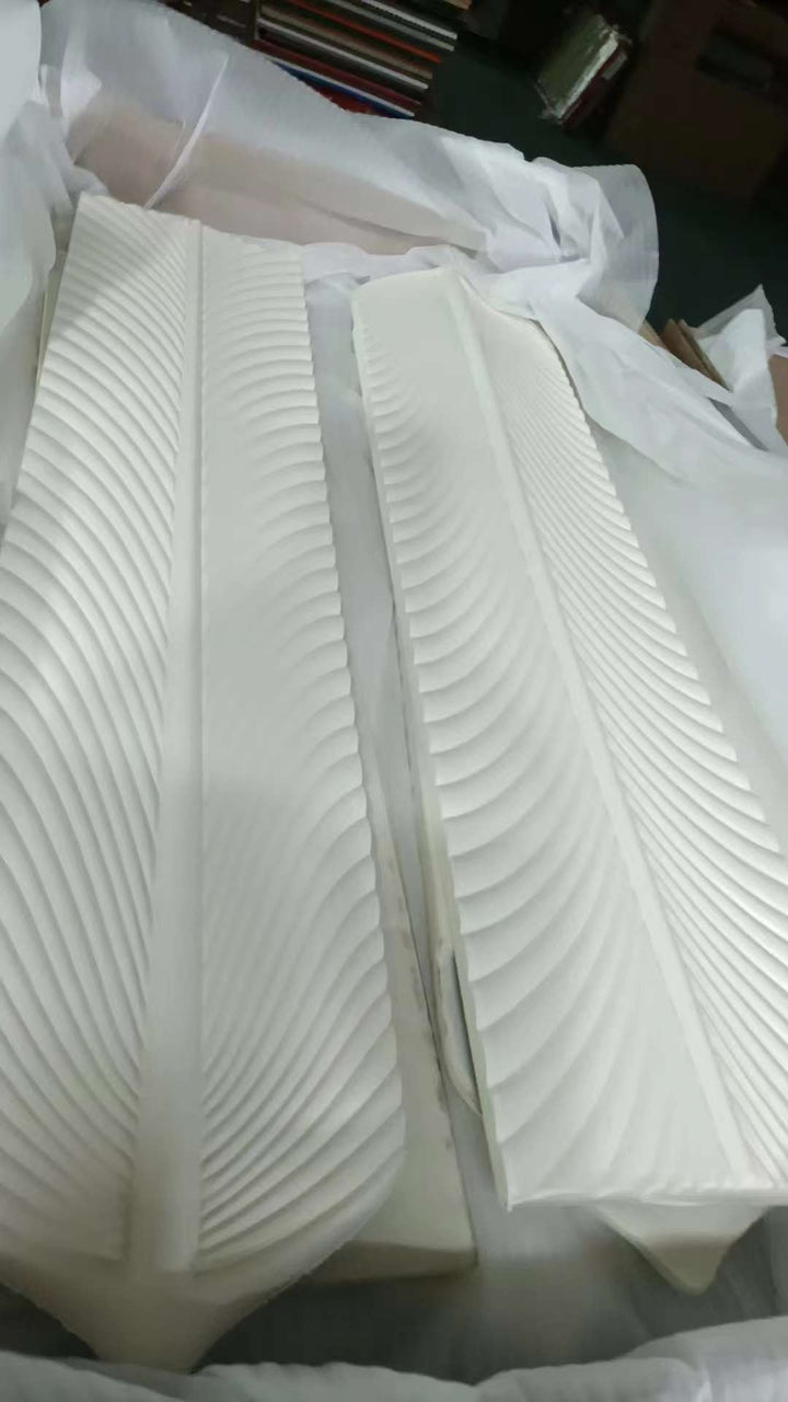 PU feather wall panels showing lightweight polyurethane material and stacked panel form