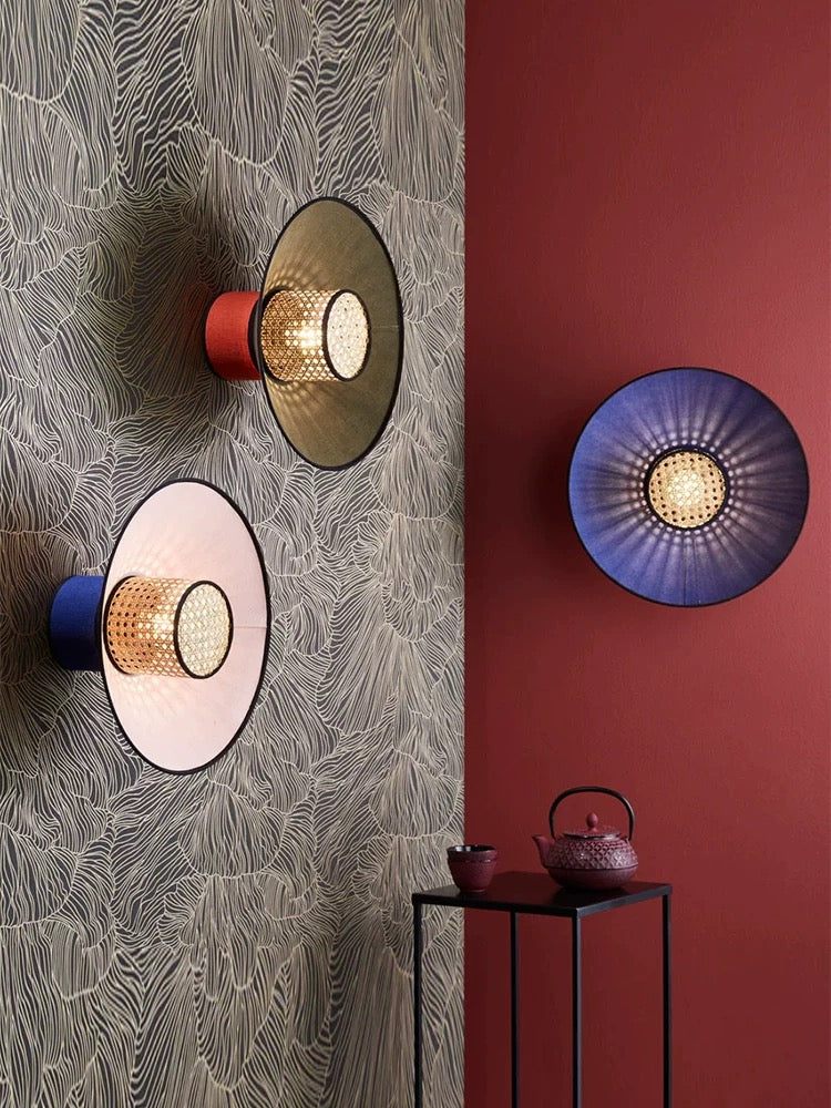 designer rattan wall lamp used as a feature light in a stylish commercial cafe interior