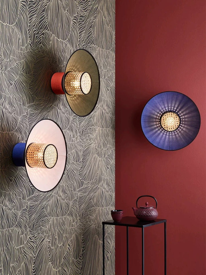 designer rattan wall lamp used as a feature light in a stylish commercial cafe interior