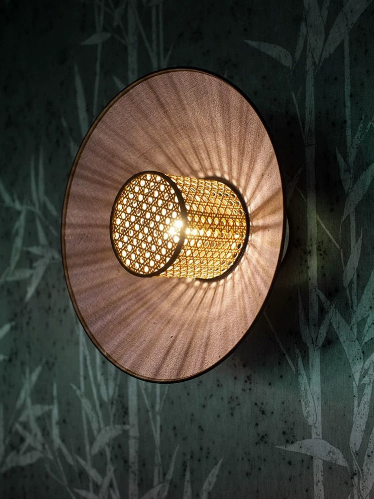 woven rattan and fabric wall light creating soft ambient illumination in a contemporary hallway