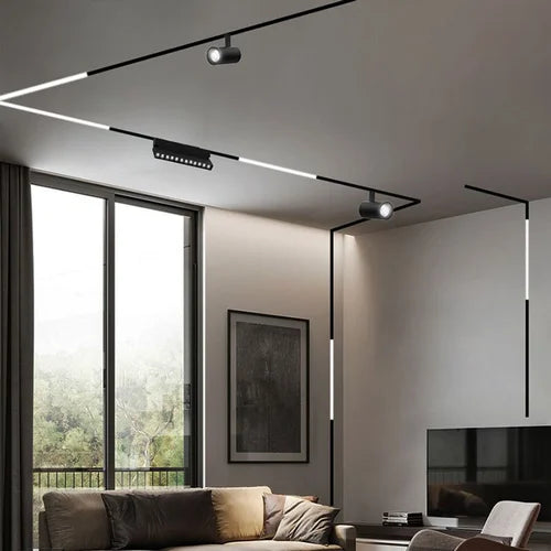 Recessed magnetic track lighting integrated into residential ceiling design using pre-plaster magnetic track profiles