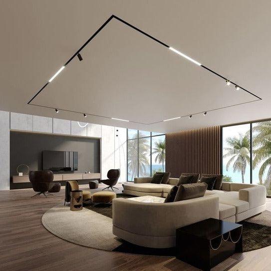 Flush recessed magnetic track lighting installed in finished gypsum board ceiling creating clean linear lighting layout for modern residential interiors

