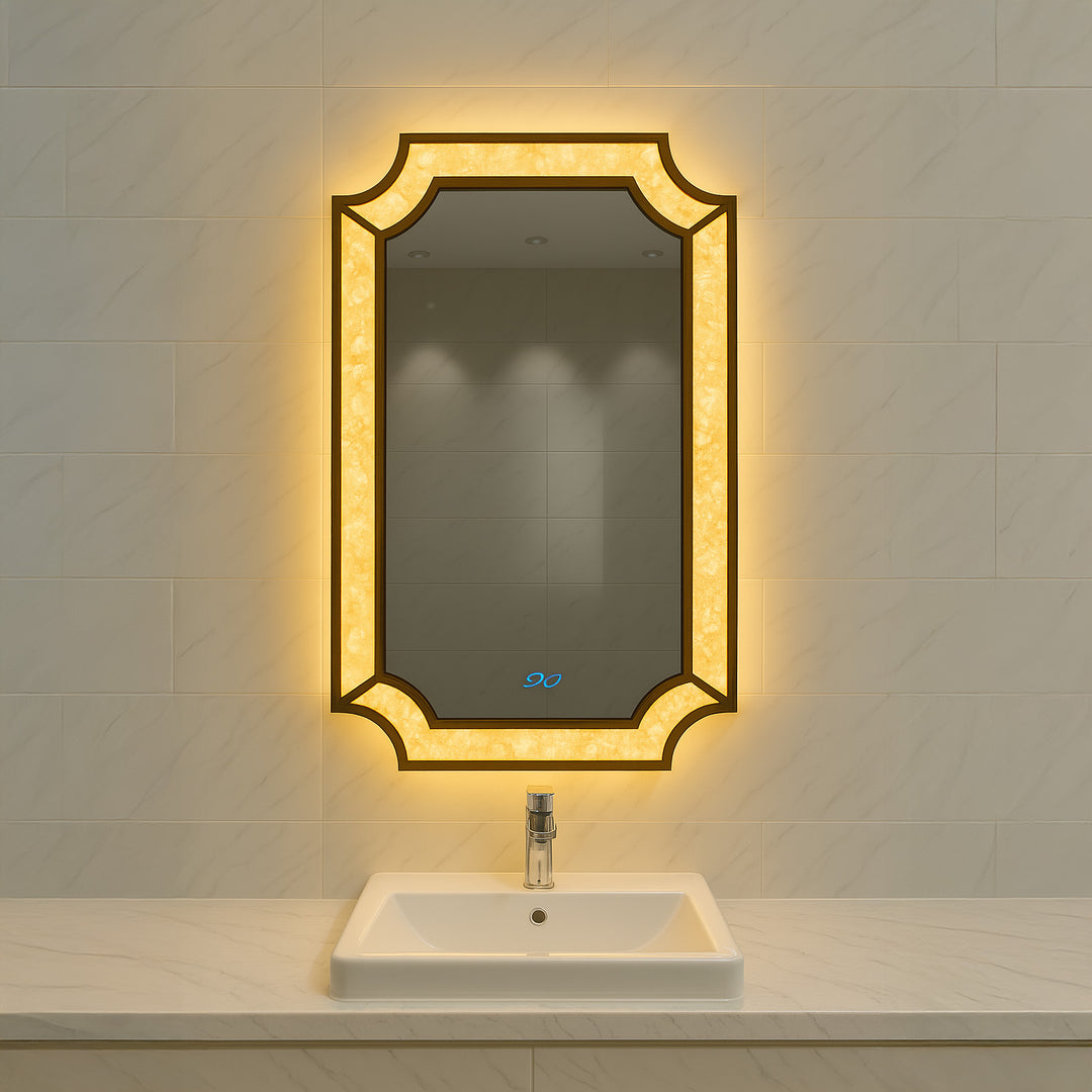 Regalia Majestic rectangular LED mirror mounted above a bathroom vanity with warm ambient lighting.