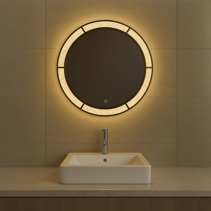 Regalia Royale round tricolour LED mirror installed in a bathroom with warm front-lit illumination.