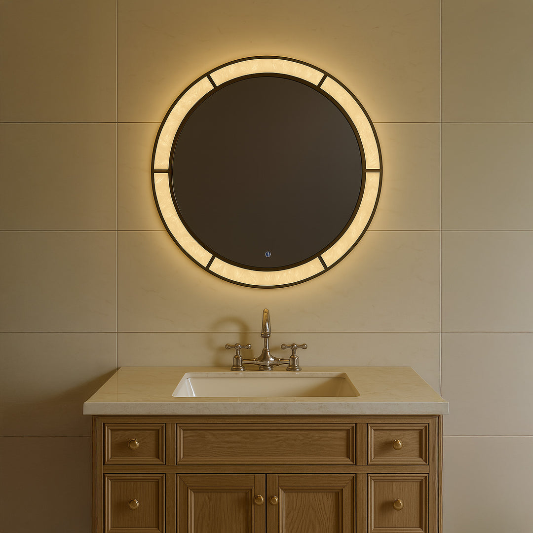 Regalia Royale circular LED mirror mounted above a bathroom vanity with soft ambient lighting.