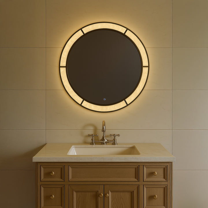 Regalia Royale circular LED mirror mounted above a bathroom vanity with soft ambient lighting.