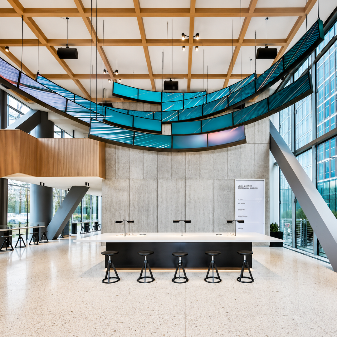 Ribbon LED display integrated into a modern corporate office environment