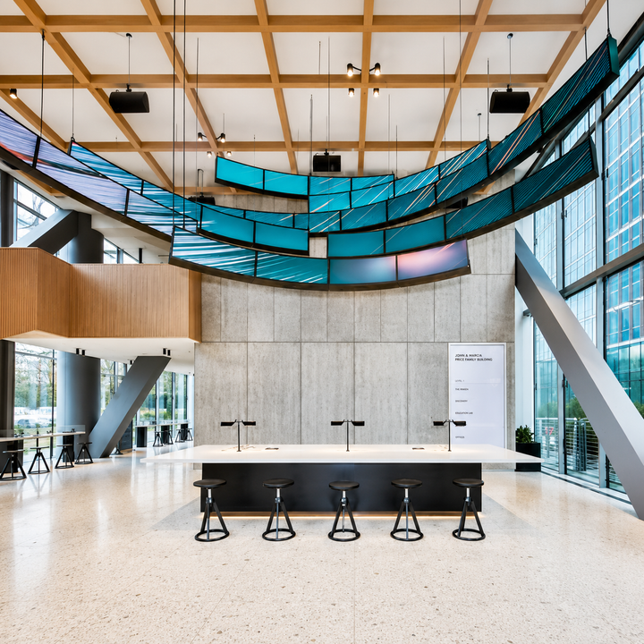 Ribbon LED display integrated into a modern corporate office environment