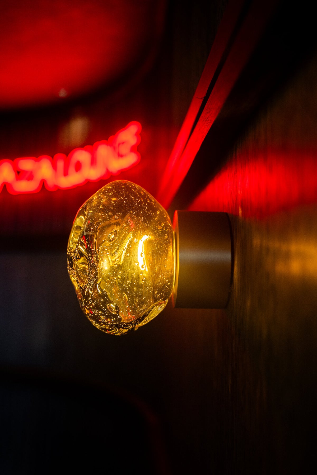 Galaxy wall lamp with the Zaza Lounge sign behind it