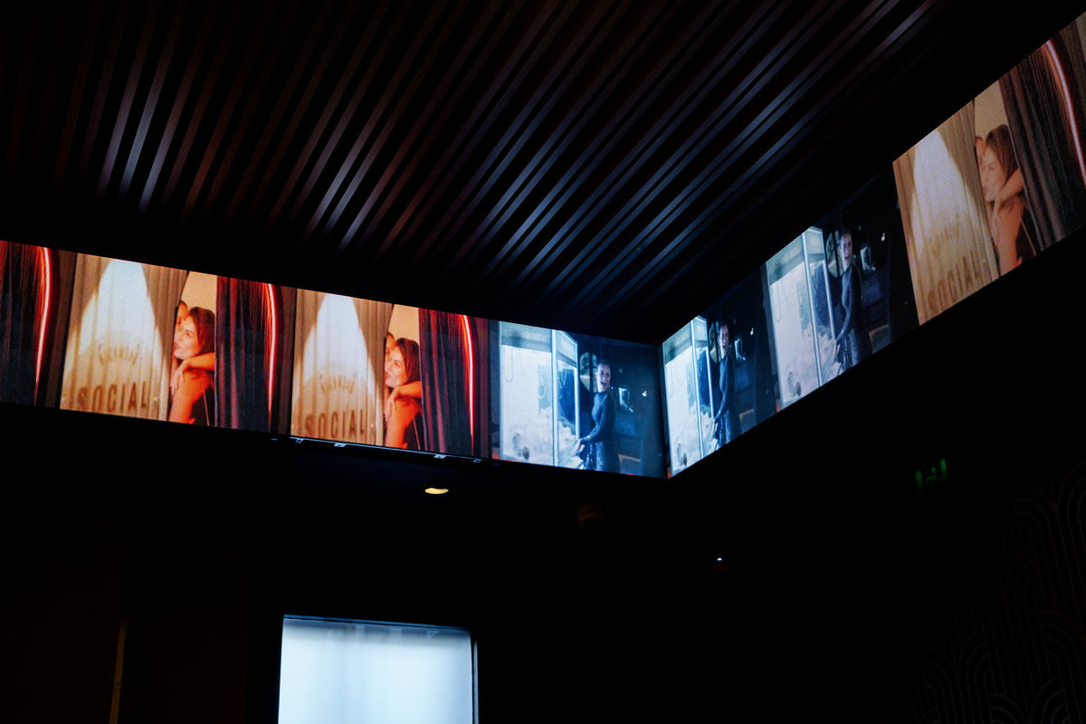 The LED banner running the length of the gaming room ceiling