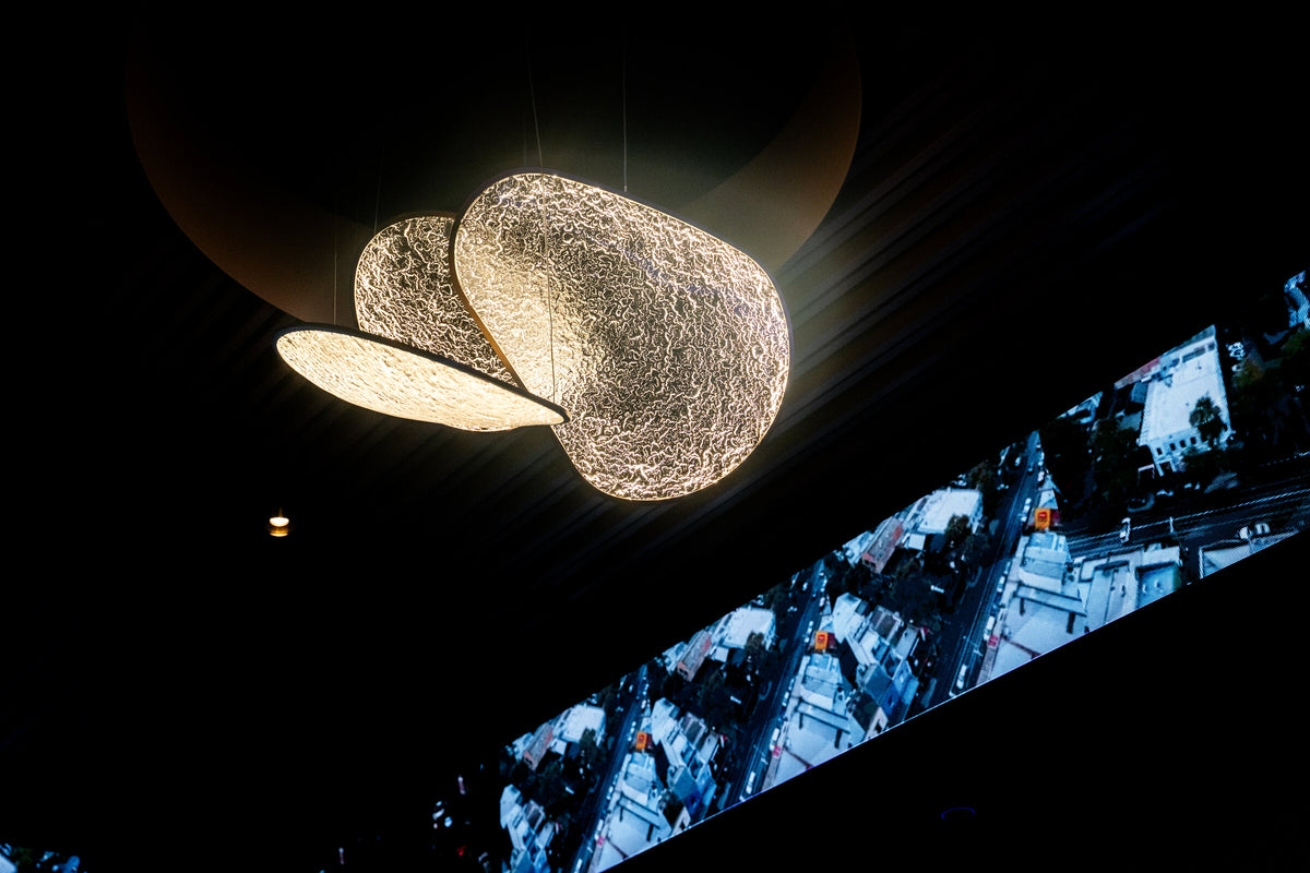 Bespoke Moonlit chandelier above the Richmond Social gaming room, with the wraparound LED banner running below it