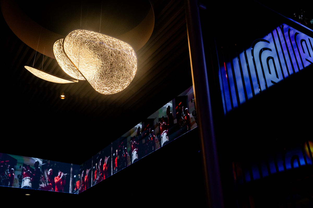 The bespoke Moonlit chandelier over the Richmond Social gaming room
